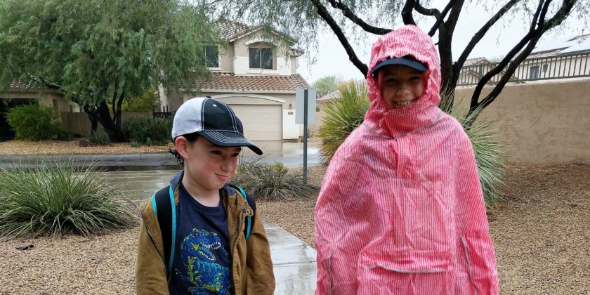 Disney Quick Tip: Pair a Baseball Hat with Your Poncho