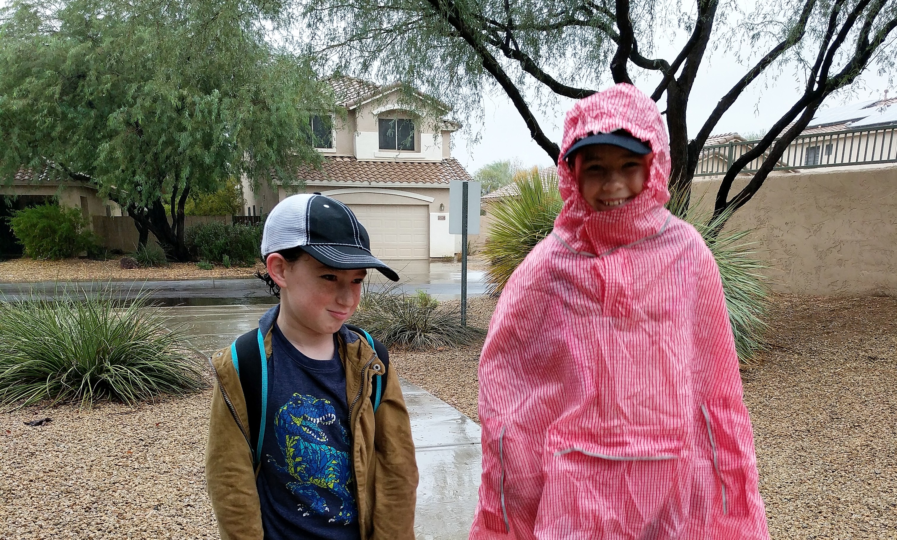 Disney Quick Tip: Pair a Baseball Hat with Your Poncho